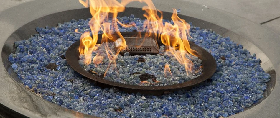 Gas fire pit in St. Louis, MO, with blue fire glass.