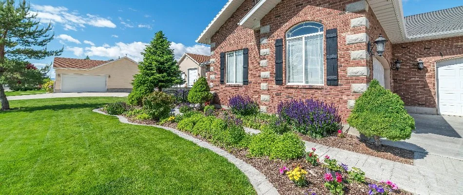 Green lawn and landscaping on a property in St. Peters, MO.
